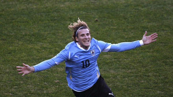 Uruguay's Diego Forlan celebrates after scoring against Paraguay during the Copa America final soccer match in Buenos Aires, Argentina, Sunday, July 24, 2011. (AP Photo/Fernando Llano)