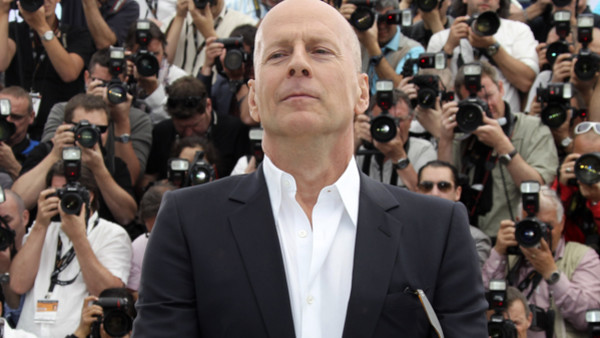 Actor Bruce Willis poses during a photo call for Moonrise Kingdom at the 65th international film festival, in Cannes, southern France, Wednesday, May 16, 2012. (AP Photo/Joel Ryan)