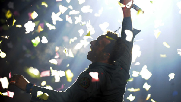 British rock band Coldplay singer Chris Martin performs during their concert at the National Stadium in Warsaw, Poland, Wednesday, Sept. 19, 2012. (AP Photo/Alik Keplicz)