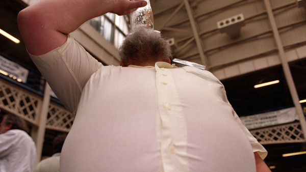 The Prince of Wales and the Duchess of Cornwall behind the bar during their visit to 'The Bell' in Purleigh, Essex where they also viewed some of the local produce grown by residents, before learning more about the arts and craft activities which 