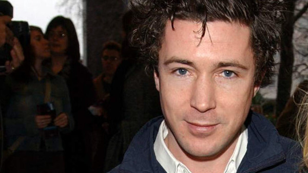 Actor Aidan Gillen who stared in the TV series Queer as Folk and his daughter Berry arrive at the premiere of Treasure Planet at the Odeon West End cinema in London.