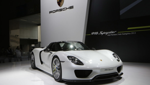 A Porsche 918 Spyder is displayed at the company's booth during the Guangzhou Auto Show in China's southern city of Guangzhou, Thursday, Nov. 21, 2013. (AP Photo/Kin Cheung)
