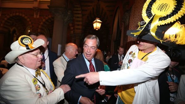 The Prince of Wales and the Duchess of Cornwall behind the bar during their visit to 'The Bell' in Purleigh, Essex where they also viewed some of the local produce grown by residents, before learning more about the arts and craft activities which 