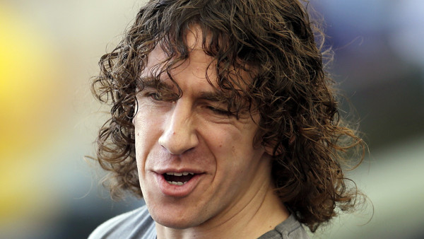 FC Barcelona former player Carles Puyol arrives to attend the World Cup final soccer match between Germany and Argentina at the Maracana Stadium in Rio de Janeiro, Brazil, Sunday, July 13, 2014. (AP Photo/Hassan Ammar)