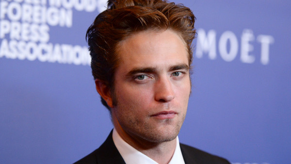 Robert Pattinson arrives at the Hollywood Foreign Press Association's Grants Banquet at the Beverly Hilton hotel on Thursday, Aug. 14, 2014, in Beverly Hills, Calif. (Photo by Jordan Strauss/Invision/AP)