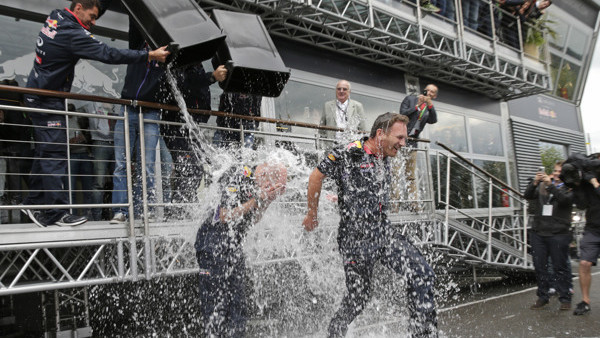 FILE - In this Saturday, Aug. 23, 2014 file photo, Red Bull team members dump buckets of ice water on Technical Chief Adrian Newey, left, and Team Chief Christian Horner at the Spa-Francorchamps circuit in Belgium for the