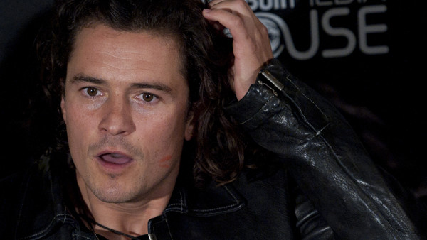 British actor Orlando Bloom poses for the media after arriving to the red carpet on a motorcycle to promotes his film ''''The Greasy Hands Preachers'', at the 62nd San Sebastian Film Festival, in San Sebastian, northern Spain, Friday, Sept. 26, 2014. The 
