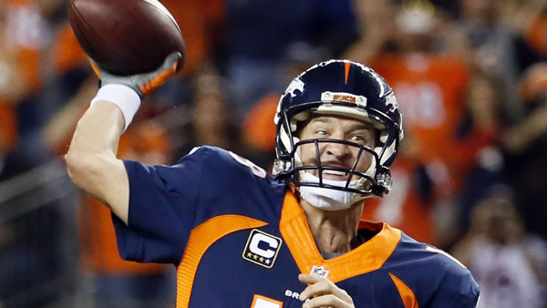 Denver Broncos quarterback Peyton Manning throws his 509th career touchdown pass to set the all time record during the first half of an NFL football game against the San Francisco 49ers, Sunday, Oct. 19, 2014, in Denver. Manning has broken Brett Favre's r