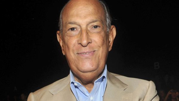 FILE - In this Sept. 11, 2011 file photo, designer Oscar de la Renta attends the Diane von Furstenberg Spring 2012 fashion show during Fashion Week in New York. Luminaries of the fashion and entertainment worlds were attending a private funeral Monday, No