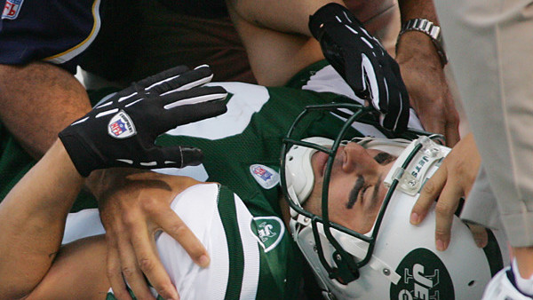 FILE - In this Sunday, Nov. 6, 2005, file photo, New York Jets' Wayne Chrebet lies unconscious while a San Diego Chargers trainer looks over him after he took a hit on a reception during the fourth quarter of an NFL football game, in East Rutherford, N.J.