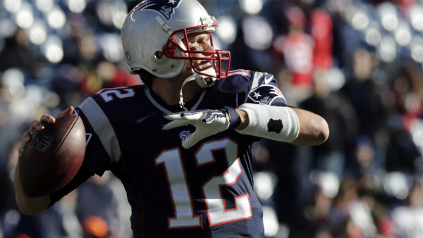 New England Patriots quarterback Tom Brady warms up before an NFL football game against the Miami Dolphins Sunday, Dec. 14, 2014, in Foxborough, Mass. (AP Photo/Charles Krupa)