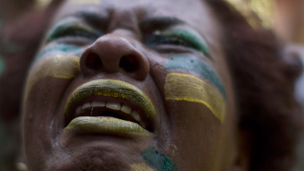 FILE - In this July 8, 2014 file photo, a Brazil soccer fan weeps as she watches Germany score repeatedly against Brazil at a World Cup semifinal match on a live telecast inside the FIFA Fan Fest area in Sao Paulo, Brazil. (AP Photo/Dario Lopez-Mills, Fil