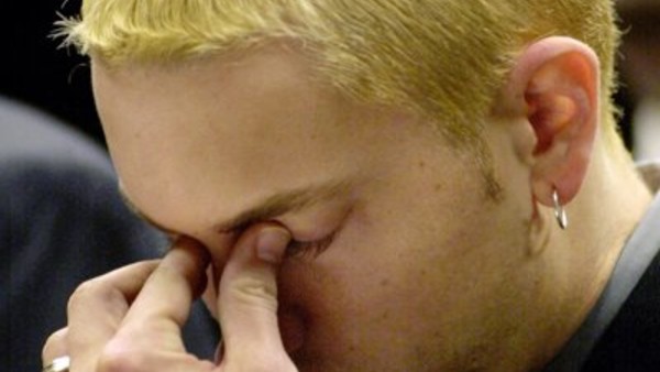 Marshall Mathers III, known as rap star Eminem, stands in court in Mount Clemens, Mich., while he was sentenced to two years probation for carrying a concealed weapon.