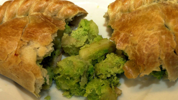 The Prince of Wales and the Duchess of Cornwall behind the bar during their visit to 'The Bell' in Purleigh, Essex where they also viewed some of the local produce grown by residents, before learning more about the arts and craft activities which 