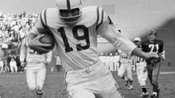 Baltimore Colts' quarterback Johnny Unitas (19) takes off for a second-quarter gain against the Washington Redskins, Dec. 1, 1963. (AP Photo/John Rous)