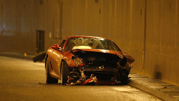 Cristiano Ronaldo's Ferrari is lifted onto a truck after it was crashed on the A538 near Wilmslow, Cheshire.