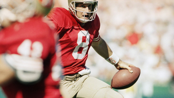 San Francisco 49ers quarterback Steve Young dodges potential trouble for a 20-yard gain Sunday, Oct. 24, 1993, during third-quarter action against the Phoenix Cardinals in San Francisco. Young led the Niners to a 28-14 win over the Cardinals. (AP Photo/Sa