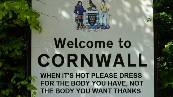 The Prince of Wales and the Duchess of Cornwall behind the bar during their visit to 'The Bell' in Purleigh, Essex where they also viewed some of the local produce grown by residents, before learning more about the arts and craft activities which 