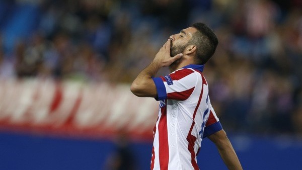 Atletico de Madrid's Arda Turan reacts during a Spanish La Liga soccer match against Levante at the Ciutat de Valencia stadium in Valencia, Spain, on Sunday, May 4, 2014. (AP Photo/Alberto Saiz)