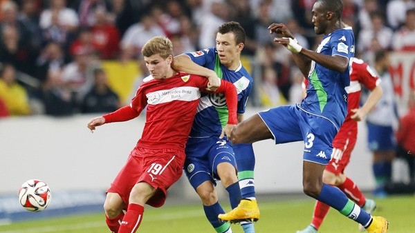 Stuttgart's Timo Werner, left, and Wolfburg's Ivan Perisic from Croatia, center, and Wolfburg's Josuha Guilavogui from France challenge for the ball during the German first division Bundesliga soccer match between VfB Stuttgart and VfL Wolfsbu
