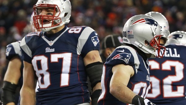 New England Patriots tight end Rob Gronkowski (87) celebrates his touchdown catch in the second half of an NFL divisional playoff football game against the Baltimore Ravens Saturday, Jan. 10, 2015, in Foxborough, Mass. (AP Photo/Elise Amendola)
