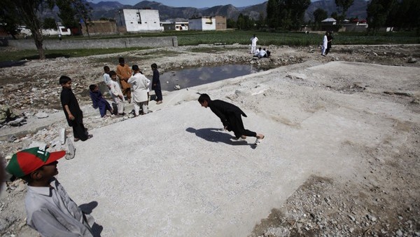 Pakistani boys play at the demolished compound of Osama bin Laden, in Abbottabad, Pakistan, Wednesday, May 2, 2012. On May 2, 2011, Osama bin Laden, the face of global terrorism and architect of the Sept. 11, 2001, attacks, was killed in a firefight with 