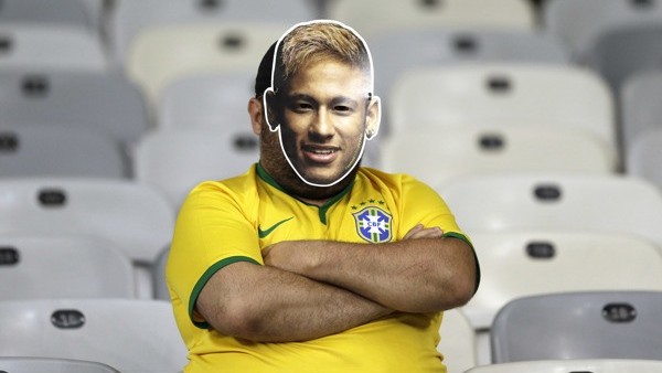A Brazil supporter wearing a Neymar face mask sits in the stands after Germany defeated Brazil 7-1 to advance to the finals during the World Cup semifinal soccer match between Brazil and Germany at the Mineirao Stadium in Belo Horizonte, Brazil, Tuesday, 