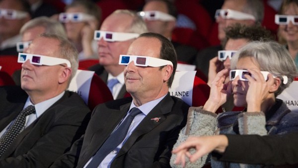 Prince William and his wife Kate Middleton, who has been given the title of The Duchess of Cambridge, kiss on the balcony of Buckingham Palace, London watched by bridesmaids Margarita Armstrong-Jones (right) and Grace Van Cutsem (left), following their we