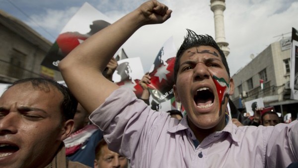 Prince William and his wife Kate Middleton, who has been given the title of The Duchess of Cambridge, kiss on the balcony of Buckingham Palace, London watched by bridesmaids Margarita Armstrong-Jones (right) and Grace Van Cutsem (left), following their we