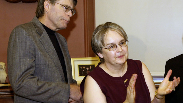 **FILE**Author Stephen King, left, his wife, Tabitha King, take part in a ceremony at the governor's office in Augusta, Maine, May 17, 2004.Mrs. King is an example of the indispensable literary spouse who helps her husband in the writing process.(AP Photo