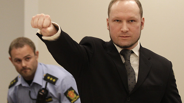 Mass murderer Anders Behring Breivik, makes a salute after arrives at the court room in a courthouse in Oslo Friday Aug. 24, 2012 . Breivik, who admitted killing 77 people in Norway last year, declared sane and sentenced to prison for bomb and gun attacks