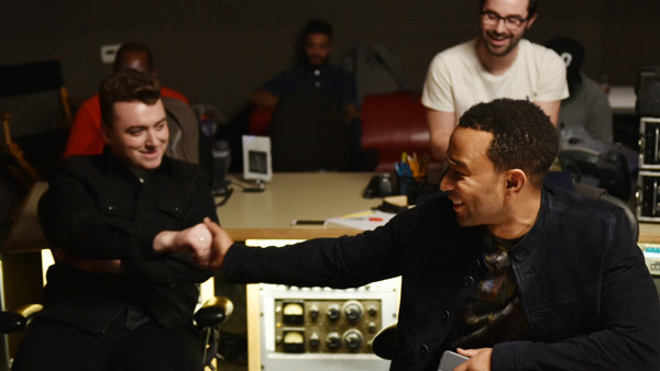 IMAGE DISTRIBUTED FOR COMIC RELIEF In this undated photo distributed Monday, March 9, 2015, Sam Smith and John Legend share a joke as they record a version of Sams song 'Lay Me Down' in a Los Angeles recording studio. The new version of the song is being 