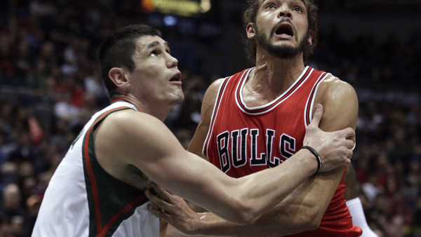 Milwaukee Bucks forward Ersan Ilyasova, left, and Chicago Bulls center Joakim Noah, right, wait for a rebound during the first half of an NBA basketball game Wednesday, April 1, 2015, in Milwaukee. (AP Photo/Darren Hauck)