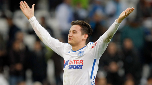 Marseille's French midfielder Florian Thauvin, waves to supporters after defeating Nantes during their League One soccer match, at the Velodrome Stadium, in Marseille, southern France, Friday, Nov. 28, 2014. (AP Photo/Claude Paris)