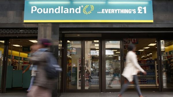 File photo dated 16/09/14 of a Poundland shop in Glasgow, as the discount retailer, which faces a probe into its takeover of rival 99p Stores, said its annual sales topped &pound;1 billion for the first time.