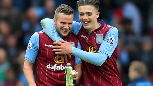 Aston Villa's Tom Cleverley (left) and Jack Grealish celebrate after the game during the Barclays Premier League match at Villa Park, Birmingham.