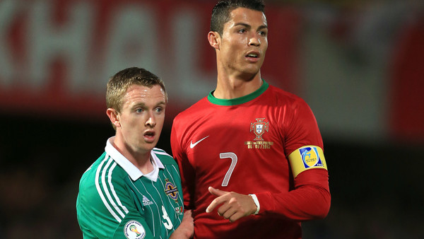 Northern Ireland's Shane Ferguson (left) with Portugal's Cristiano Ronaldo