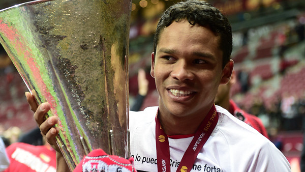 Sevilla Carlos Bacca celebrates with the UEFA Europa League trophy