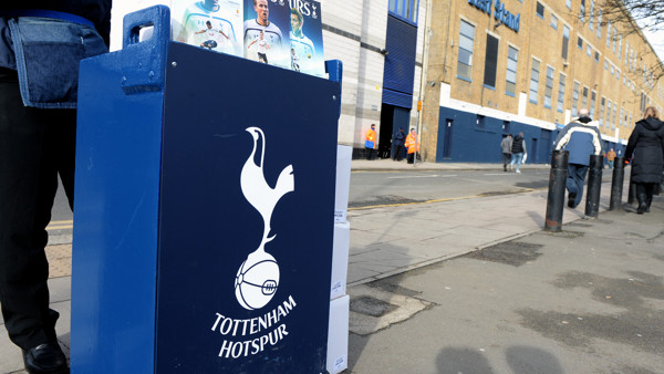 A match programme seller outside of White Hart Lane