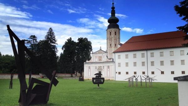 In this photo taken Tuesday, Jan. 27, 2015, shows Lake Bled in Slovenia with a island and the Church of Our Lady on it. Tucked in the southwestern corner of Slovenia, between Austria and Italy, stands a spectacular landscape: a lush tiny island in the mid