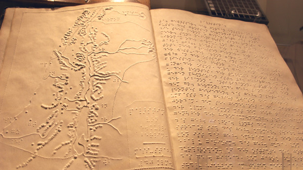 braille book and map