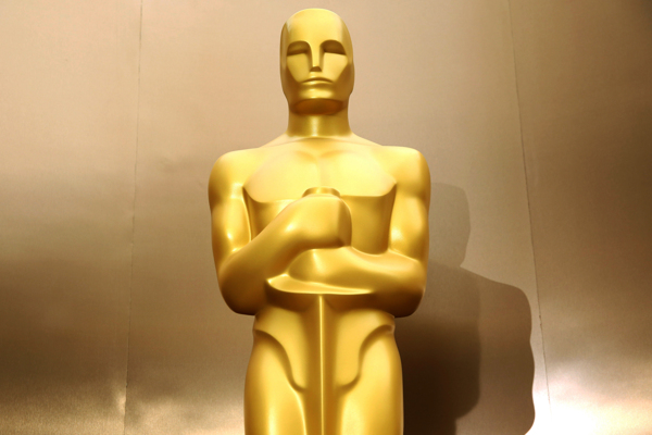 An Oscar statue stands on the red carpet as preparations are made for the 86th Academy Awards in Los Angeles, Friday, Feb. 28, 2014. The Academy Awards will be held at the Dolby Theatre on Sunday, March 2. (Photo by Matt Sayles/Invision/AP)