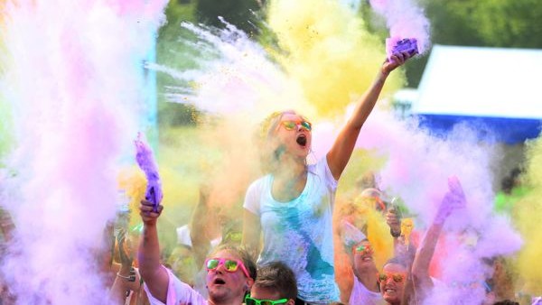 Jess Wadey (centre) from Manchester takes part in the Colour Me Rad 5km run in Heaton Park, Manchester.