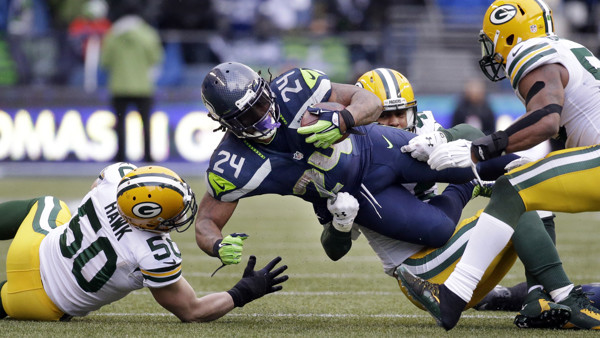 Seattle Seahawks' Marshawn Lynch carries against the Green Bay Packers during the second half of the NFL football NFC Championship game Sunday, Jan. 18, 2015, in Seattle. (AP Photo/Elaine Thompson)
