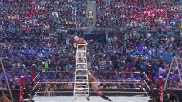 Zayn pushes over Sin Cara on ladder.gif