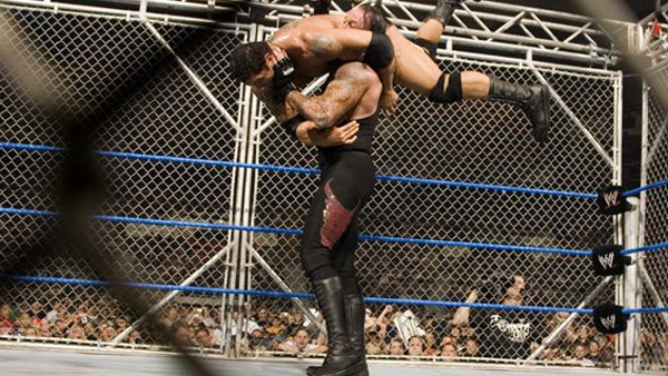 Undertaker Prepares Batista For Tombstone