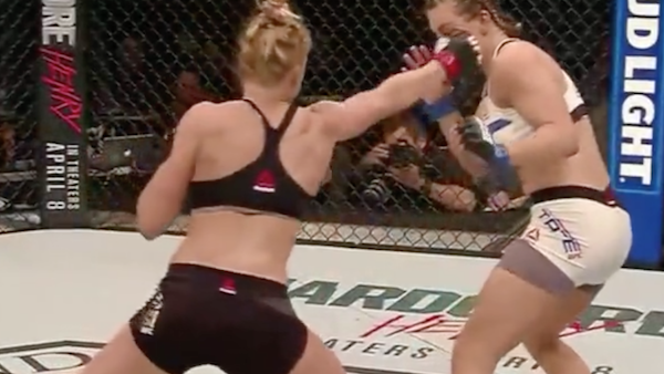 Miesha Tate, left, celebrates victory over Holly Holm in their UFC 196 womens bantamweight mixed martial arts match, Saturday, March 5, 2016, in Las Vegas. (AP Photo/Eric Jamison)