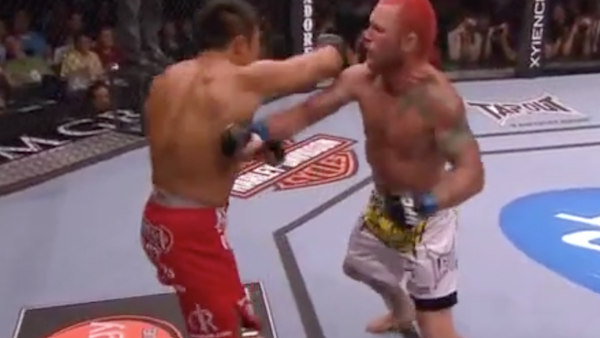 Miesha Tate, left, celebrates victory over Holly Holm in their UFC 196 womens bantamweight mixed martial arts match, Saturday, March 5, 2016, in Las Vegas. (AP Photo/Eric Jamison)