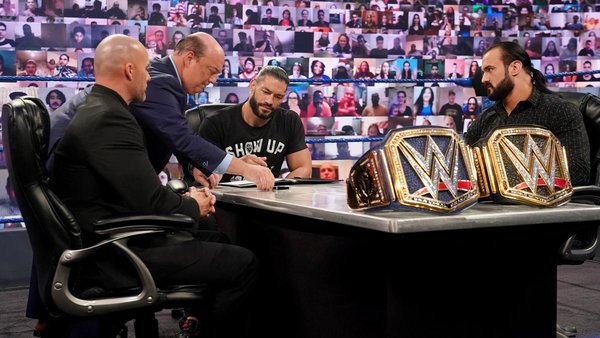 Roman Reigns Drew McIntyre Paul Heyman Adam Pearce