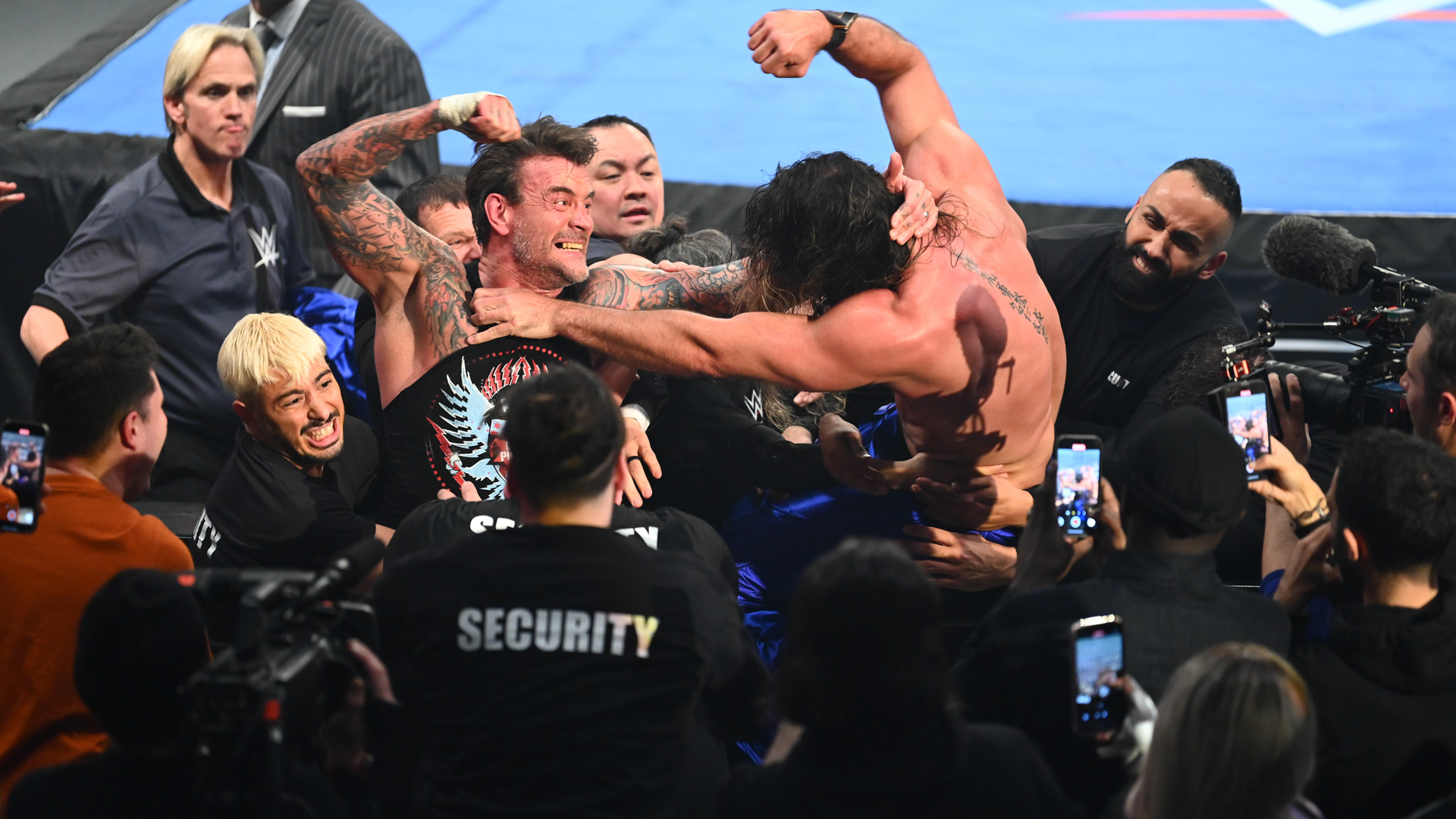 CM Punk Seth Rollins Roman Reigns Brawl